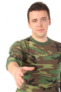 man in camouflage greets