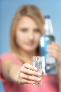 Teenage Girl Holding Glass Of Spirits